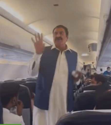 A Pakistani man asks for donations on a plane